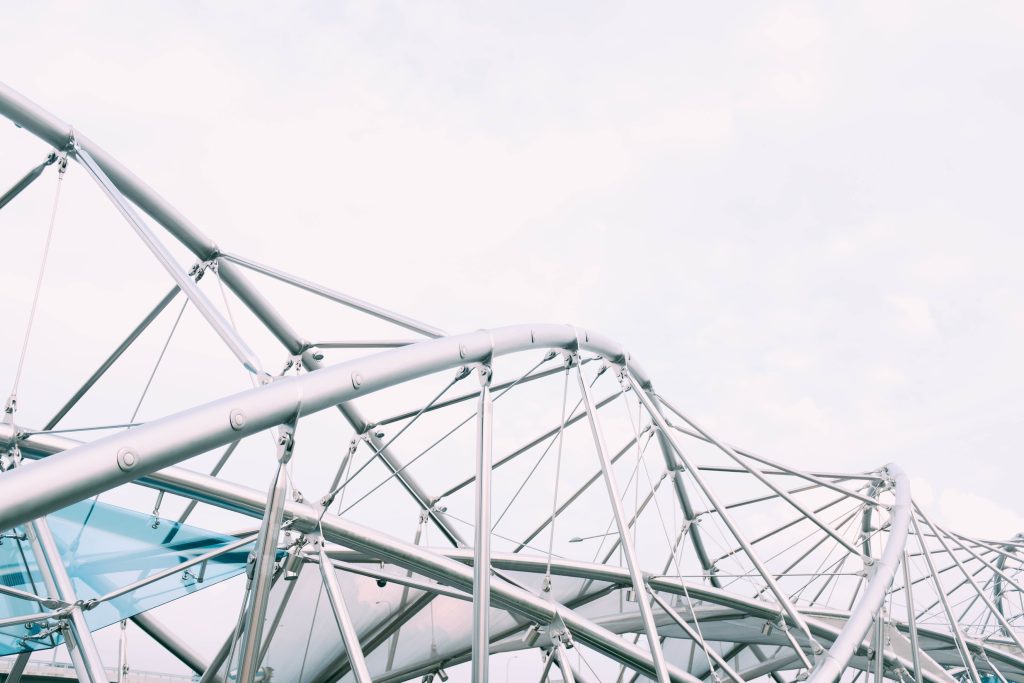 Landscape of a silver modern power tower under a cloudy sky